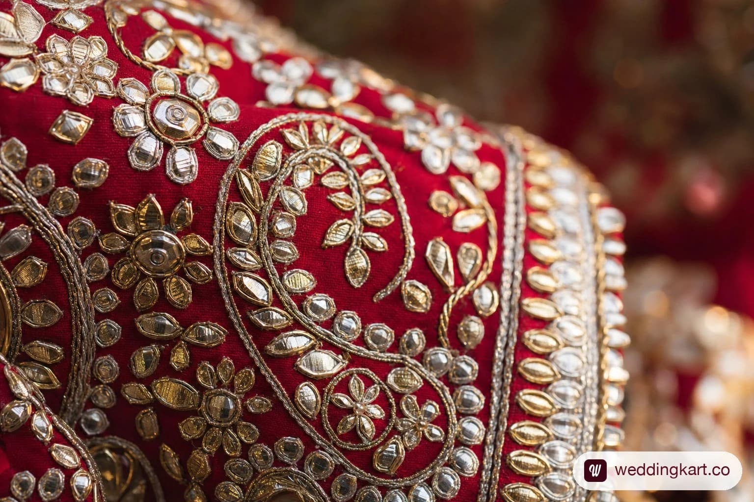 Close-up of gota patti metallic embroidery on a chaniya choli showing raised ribbon appliqué work