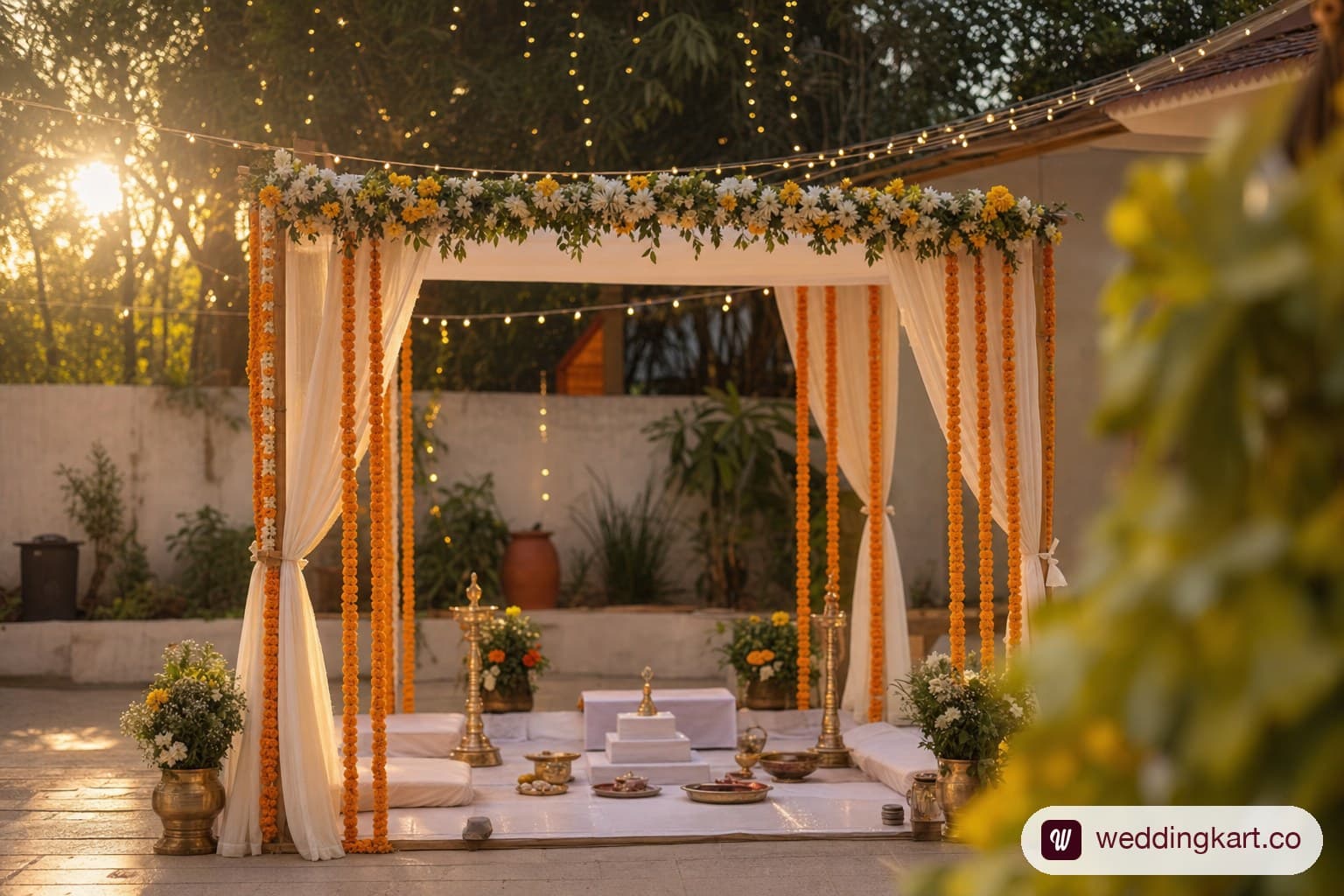 Simple budget-friendly wedding mandap decorated with marigolds and fairy lights.