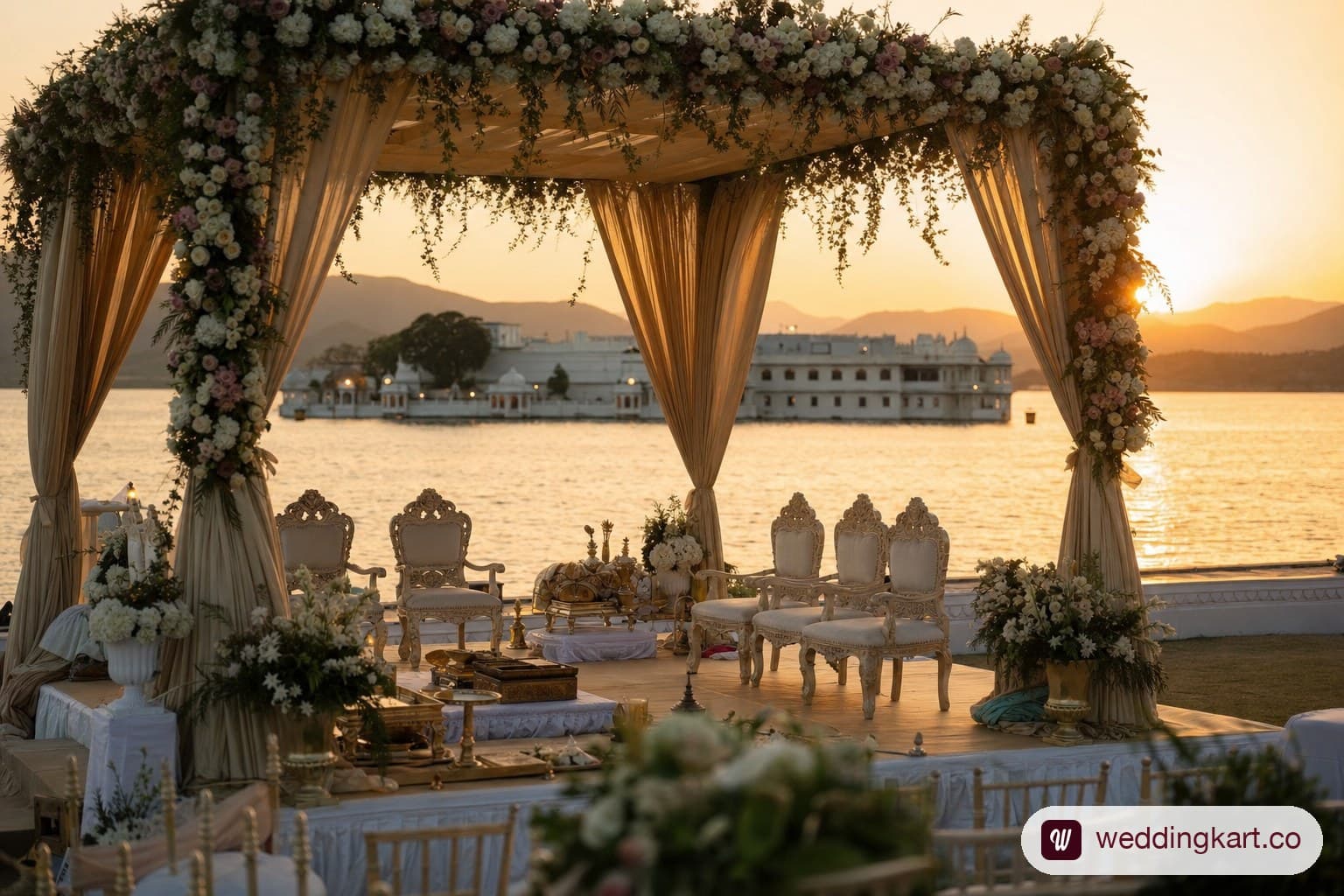 Wedding mandap at sunset on a lake in Udaipur.